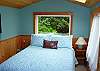 This bedroom has a comfortable full sized bed with a lovely east side view of the foliage in the back yard.
New window shades have recently been added to this room including the skylight window above the bed.