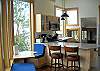 Enjoy visiting with "the cook" while sitting on the bars stools in this open, airy kitchen area.