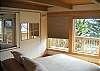 Wooden slider boards provide total privacy from the dining/sitting room. Wake in either Queen bedroom to panoramic views, or sleep in, shielded by black-out window coverings that let you decide when dawn arrives. North side windows may be opened to provide fresh ocean air breezes &amp; soothing sounds of the waves rolling into shore. An exit door leads out to the full west deck as well.