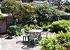 Surrounded in lovely foliage over and around the fence, you'll enjoy the privacy of this patio as well as the morning southerly sun while you enjoy your morning coffee.  There is also a new charcoal BBQ, patio table and chairs with which to enjoy your favorite meals outdoors.  Also a picnic table in the westside yard.