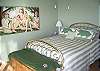 Master Queen bedroom has bath w/ shower, sliding glass door out onto full West deck.