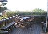 You'll enjoy the privacy that the full west hedge provides on the spacious patio deck.