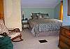 This spacious bedroom has a Queen bed, rocking chair and sofa as well as a 2nd TV & DVD player.