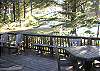 This beautifully treed lot has a nice patio deck on which to enjoy picnics and the lovely evening ocean sunset views.