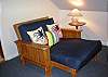 Relaxing futon sofa in dormer can also serve as a single bed.