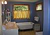This bathroom provides a shower as well as a cute little claw foot tub, great for bathing the "little ones" after a day at the beach!
There is also a bathroom with just toliet and sink on the upstairs level where the bedrooms are located.