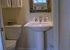 Master Queen bedroom has half bath for added convenience.