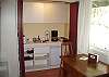 The attached studio provides a small kitchen w/ coffee maker, snack fridge & microwave.