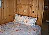 Located just off the Family room, another Queen bedroom with an accordian door for privacy.
