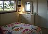 Each bedroom is nicely furnished with a dresser &amp; closet space. This Queen bedroom has an oceanview as well.