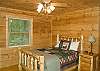 Cozy queen size log cabin bed and HD TV.  Adjoining guest bath wtih whirlpool tub and seperate shower.