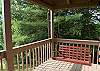 The covered porch offers lots of space to relax and unwind, enjoy the porch swing..