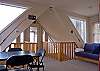 The loft is on the second level and offers a full size futon, game table and access to a private covered balcony.