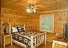 Cozy queen size log cabin bed and HD TV. Adjoining Master Bath wtih whirlpool tub and seperate shower.