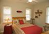 Main level bedroom features double size bed and seperate full bath.