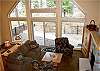 Another view of the living room and back deck as seen through large windows