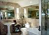 Master Suite Bath with soaking tub and large glass shower