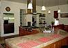 Gourmet kitchen with stainless appliances, extra large counter space and Thermador range