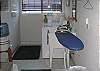 laundry room w/ ironing board and iron