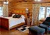 Master Suite Includes a King Bed with Out-Door Access to the Hot-Tub and view of Lake