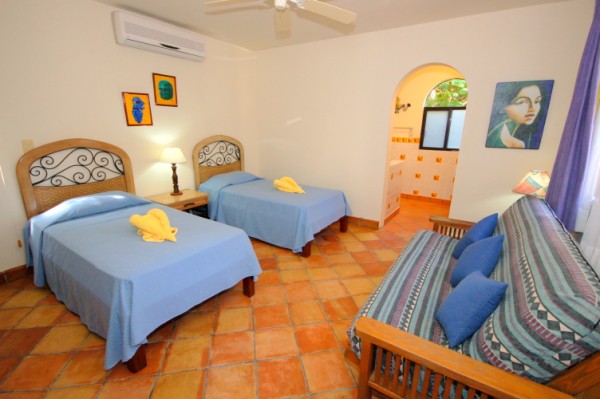 Lower guest bedroom with 2 single/twin beds and double futon.-Thumbnail