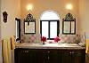 Master bathroom with twin vanity, shower, and dressing area.-Thumbnail