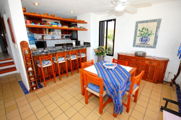 Dining and kitchen areas with breakfast bar.-Thumbnail