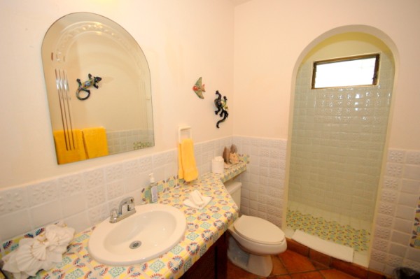 Extra guest bathroom with shower accessed from hallway.-Thumbnail