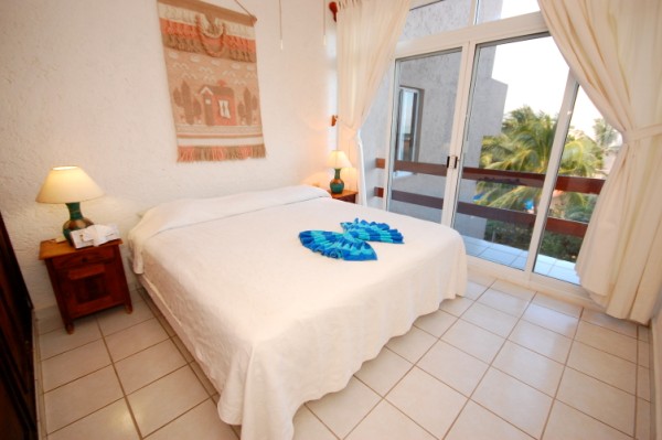 La Sirena condos # 8, Guest bedroom with garden view terrace.-Thumbnail