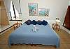 Master bedroom with King sized bed and ocean views.-Thumbnail