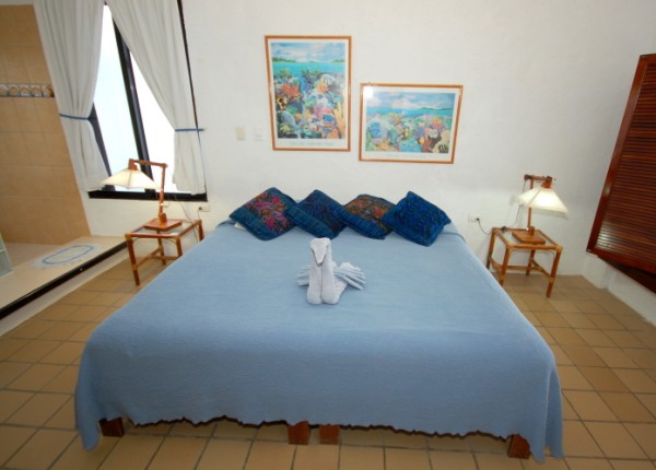 Master bedroom with King sized bed and ocean views.-Thumbnail
