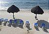 Groomed beach and palapas in front of Yool Caanal condos-Thumbnail