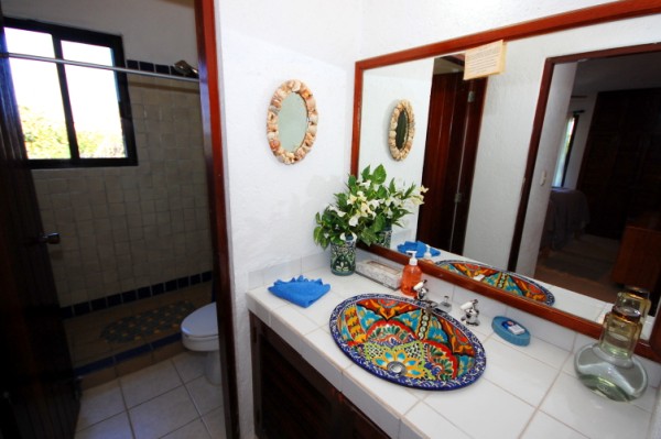 Guest bathroom with single vanity and shower.-Thumbnail