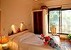 Casita bedroom with queen bed and jungle view.-Thumbnail
