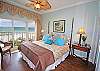 Master bedroom has comfy king bed and great views!