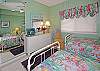 Guest room is complete with two beds and a TV!