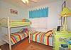 2nd bedroom has bunk and TV plus a trundle.  Great place for kids to be!