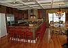 Large gourmet kitchen, breakfast bar, and dining room