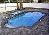 After an active game of volleyball, cool off in this exquisite pool surrounded by brick pavers or relax in the hot tub.  That's living at it's best!