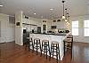 Kitchen Features 2 Refrigerators, 2 Ovens, Stainless Steel Appliances & Granite Countertops, Breakfast Bar for Additional Seating