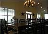 Between the dining room which seats 8 and the bar stools which seat another 6, you can all enjoy a meal together.  No more eating in shifts.