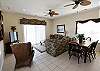 The living room features a 42" flat screen TV. Sliding glass door for access onto the first level covered porch.