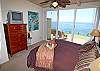 Bedroom with ocean views, patio access