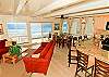 Living room, kitchen bar, dining room, all overlooking the ocean