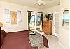 Bedroom with beachfront patio access, ensuite bathroom