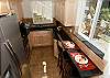 kitchen with granite counters, stainless appliances