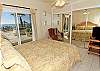 Bedroom at beach level, with patio access, ensuite bathroom