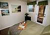 bedroom with ocean view, queen sized bed