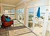Beach level sunroom!  Sleep on the fold out futons and stare out to the ocean.