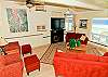 Living room with fireplace and flat screen tv, ocean views
